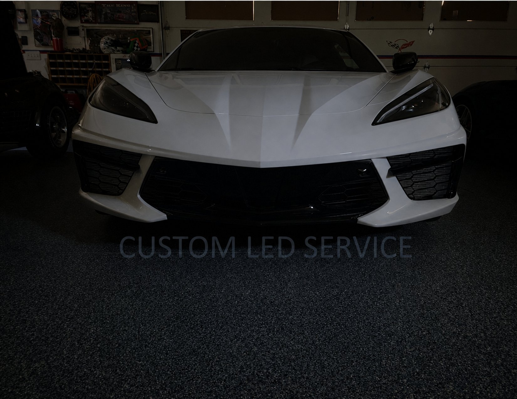 The same Corvette C8 with stock, unlit grilles